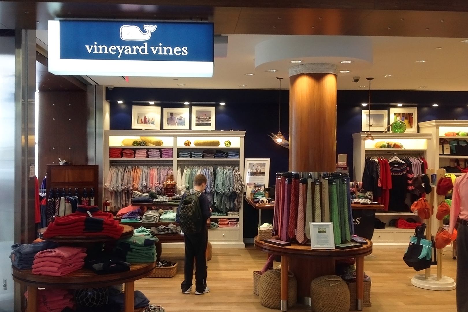 Wide view, free standing apparel displays fill the space, wall displays in the background.
